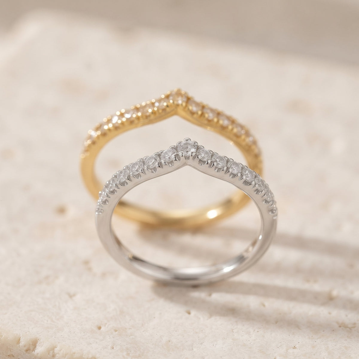 Diamond wishbone half eternity rings in 18k white gold and 18k yellow gold