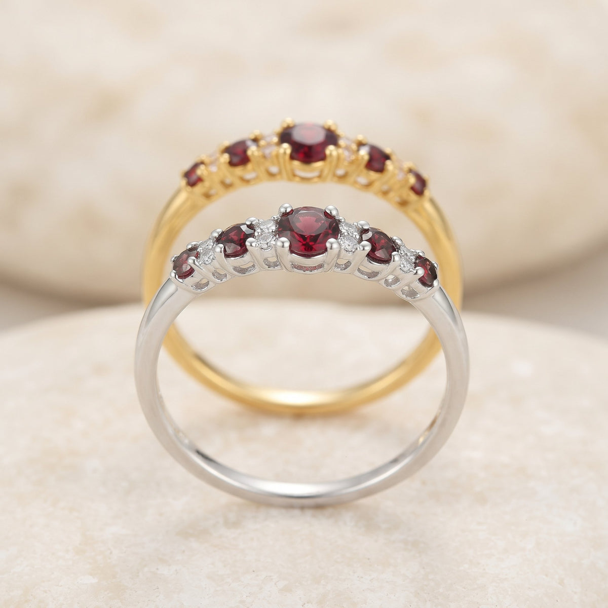 Ruby and diamond graduated five stone rings in 18k white gold and 18k yellow gold