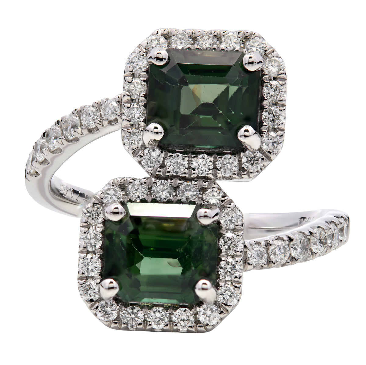 Green sapphire and diamond crossover ring in platinum
