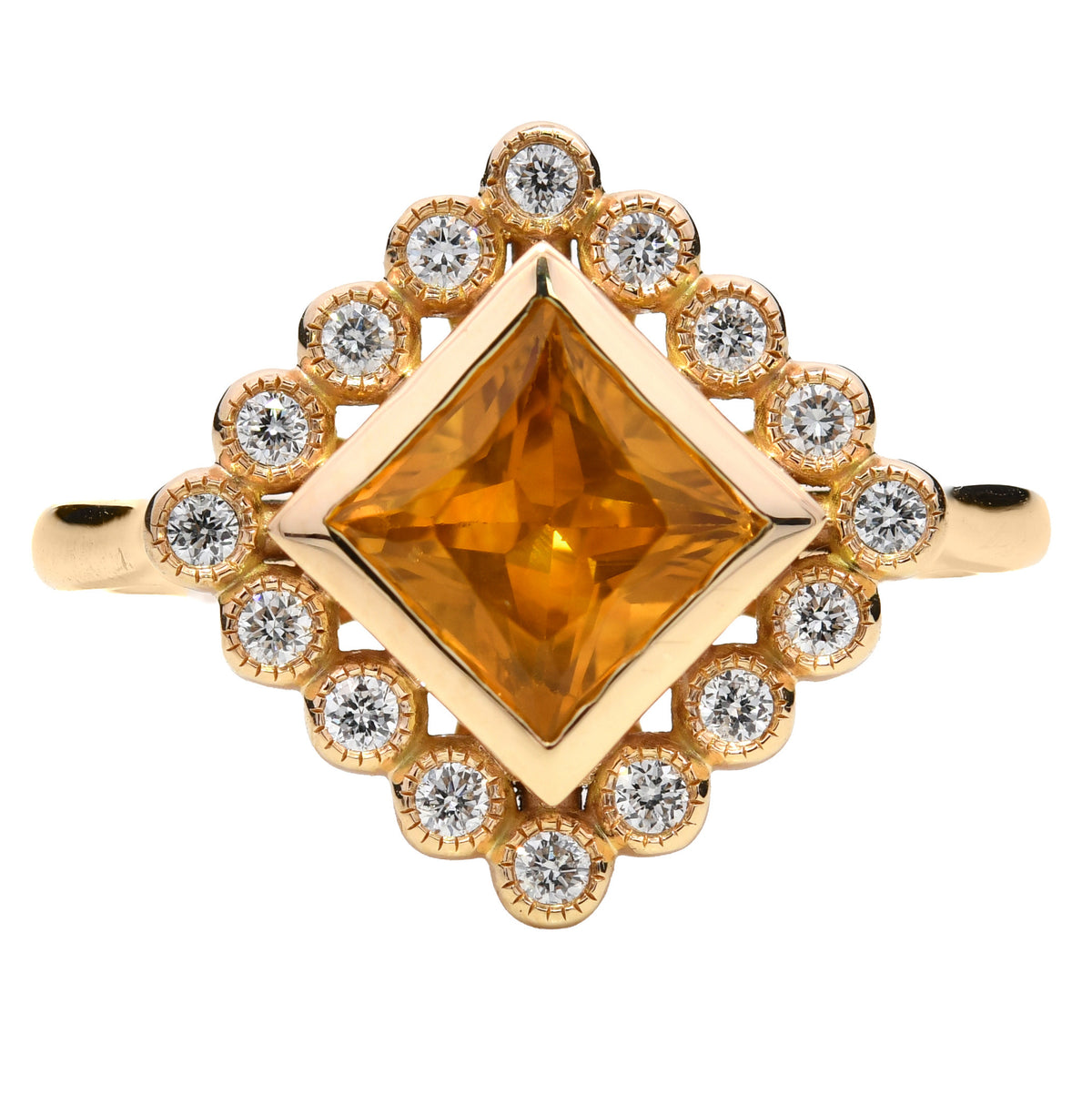 Orange sapphire and diamond cluster ring in 18k yellow gold