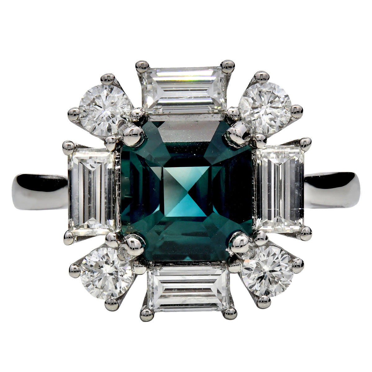 Teal sapphire and diamond cluster ring in platinum