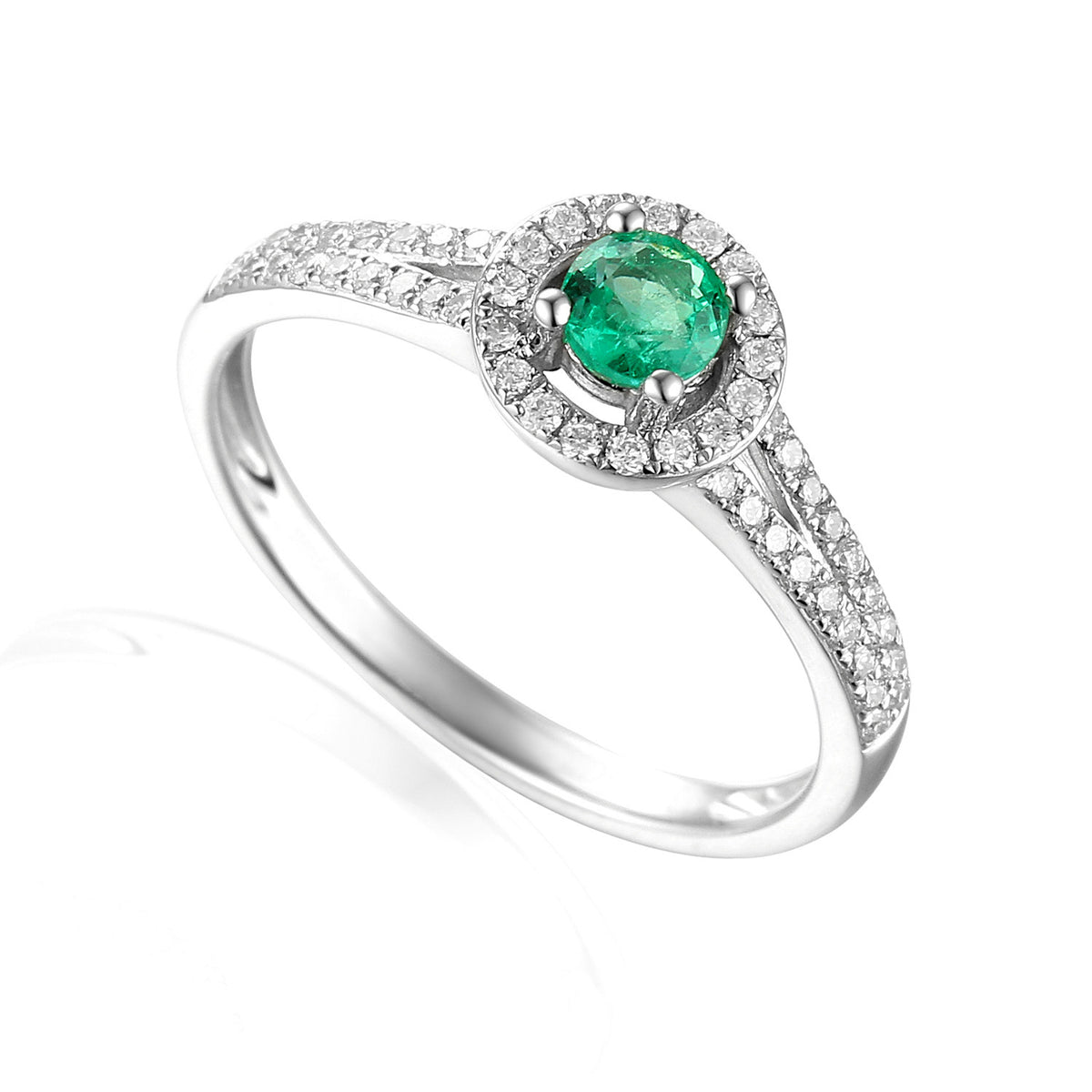 Emerald and diamond halo ring in 18k white gold