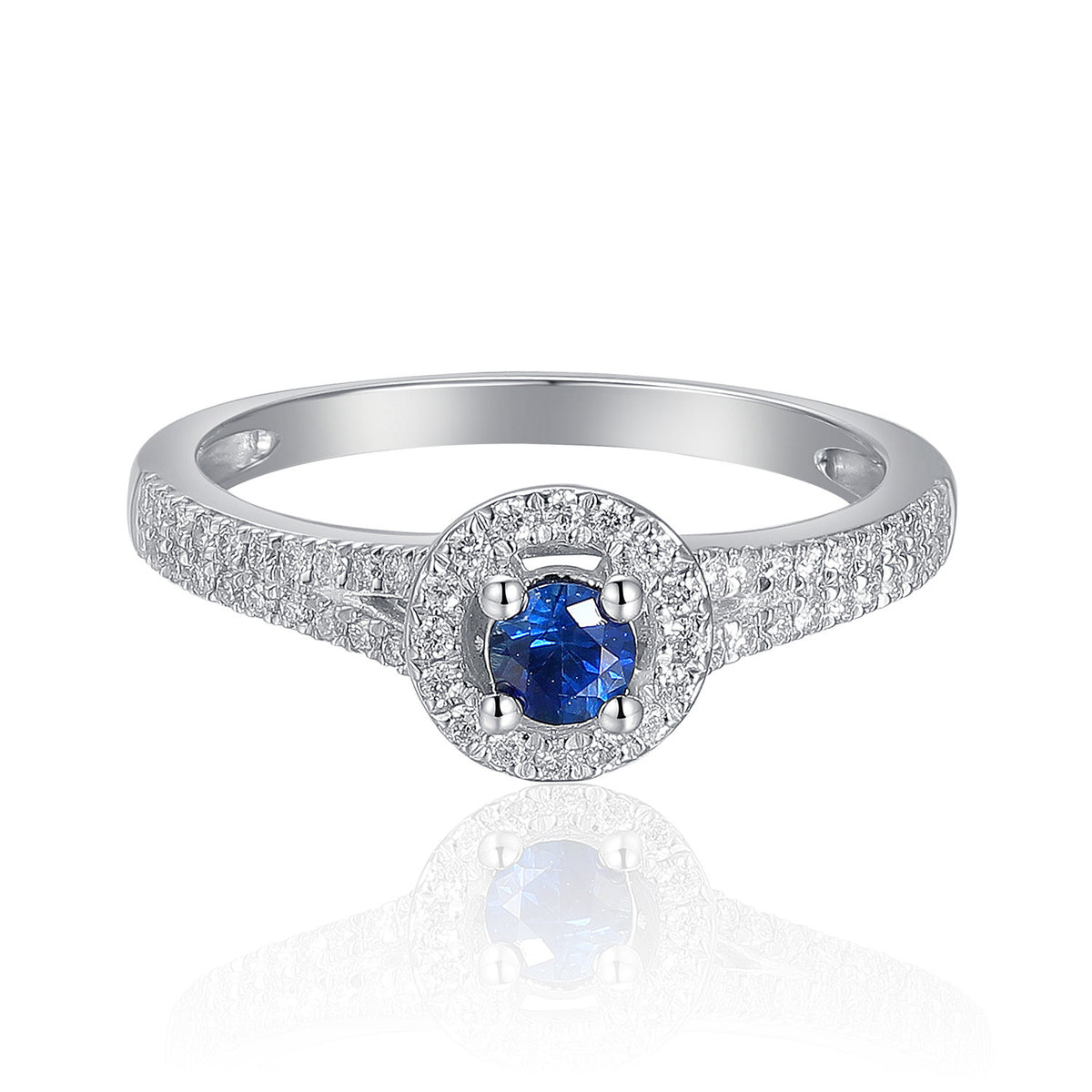 Blue sapphire and diamond halo ring in 18k white gold