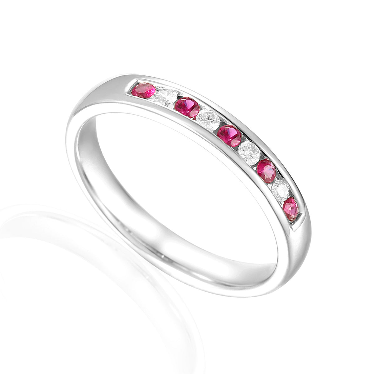 Ruby and diamond channel set half eternity ring in 18k white gold
