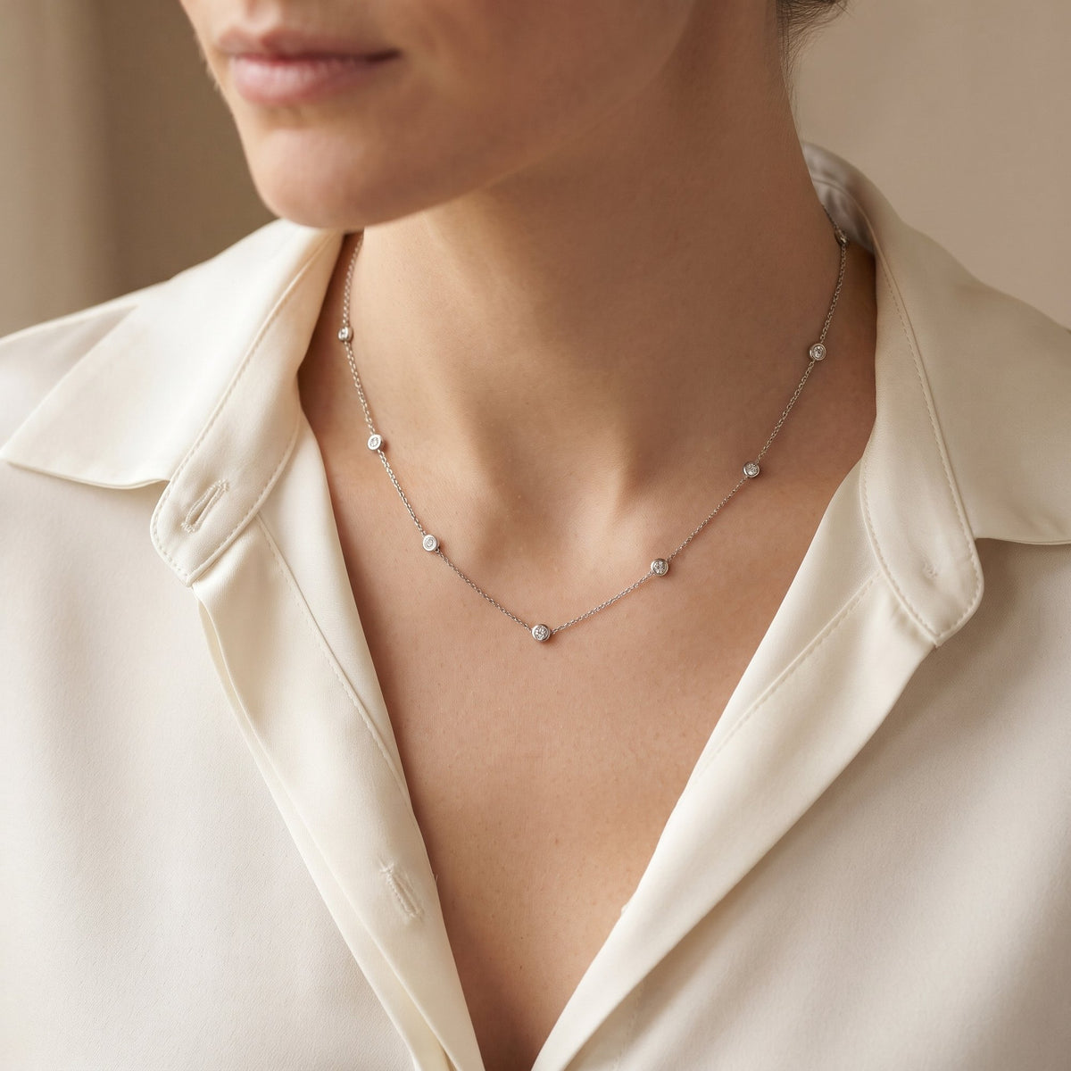 18k white gold rubover diamond by the yard necklace worn at the neck