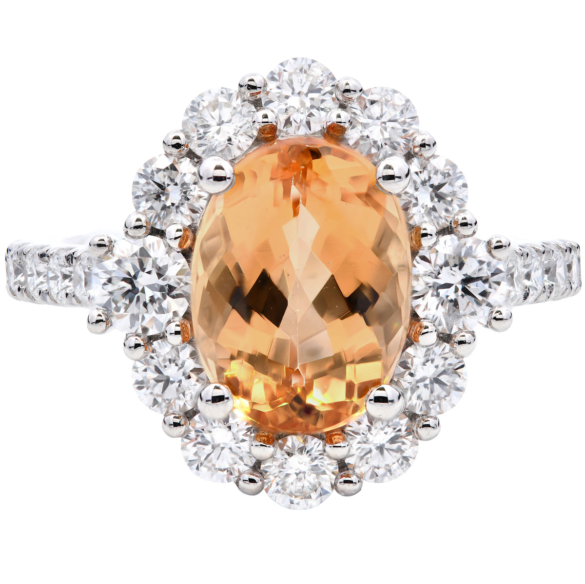 Golden topaz and diamond oval cluster ring in platinum