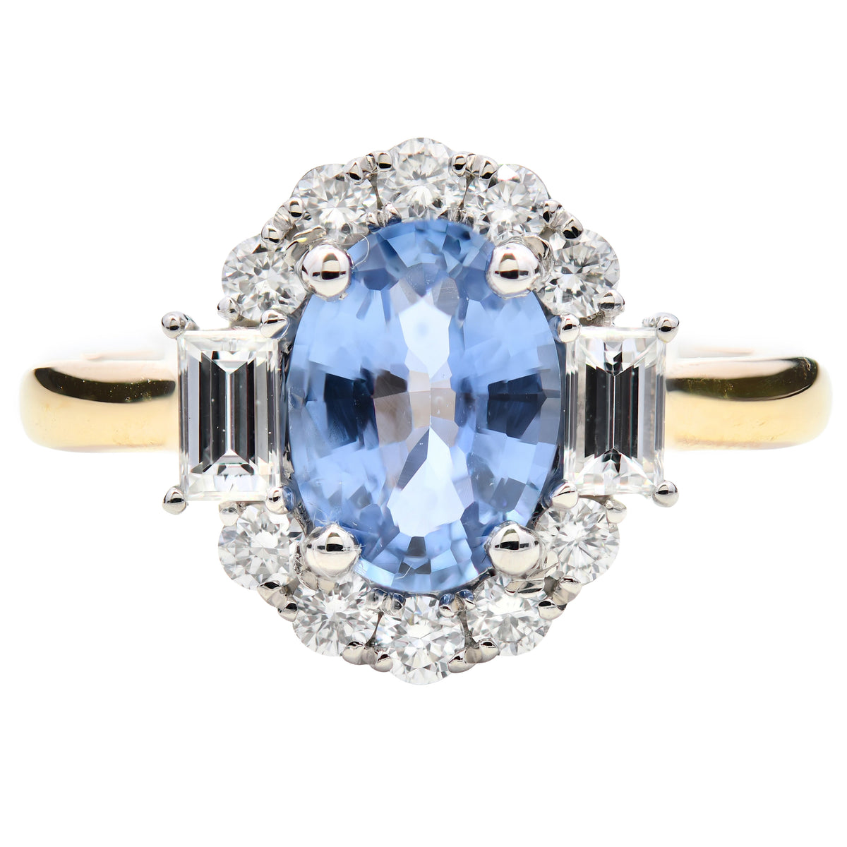Purple sapphire and diamond oval halo ring in 18k yellow gold and platinum