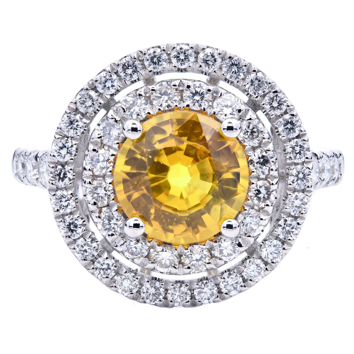 Yellow sapphire and diamond halo ring in platinum