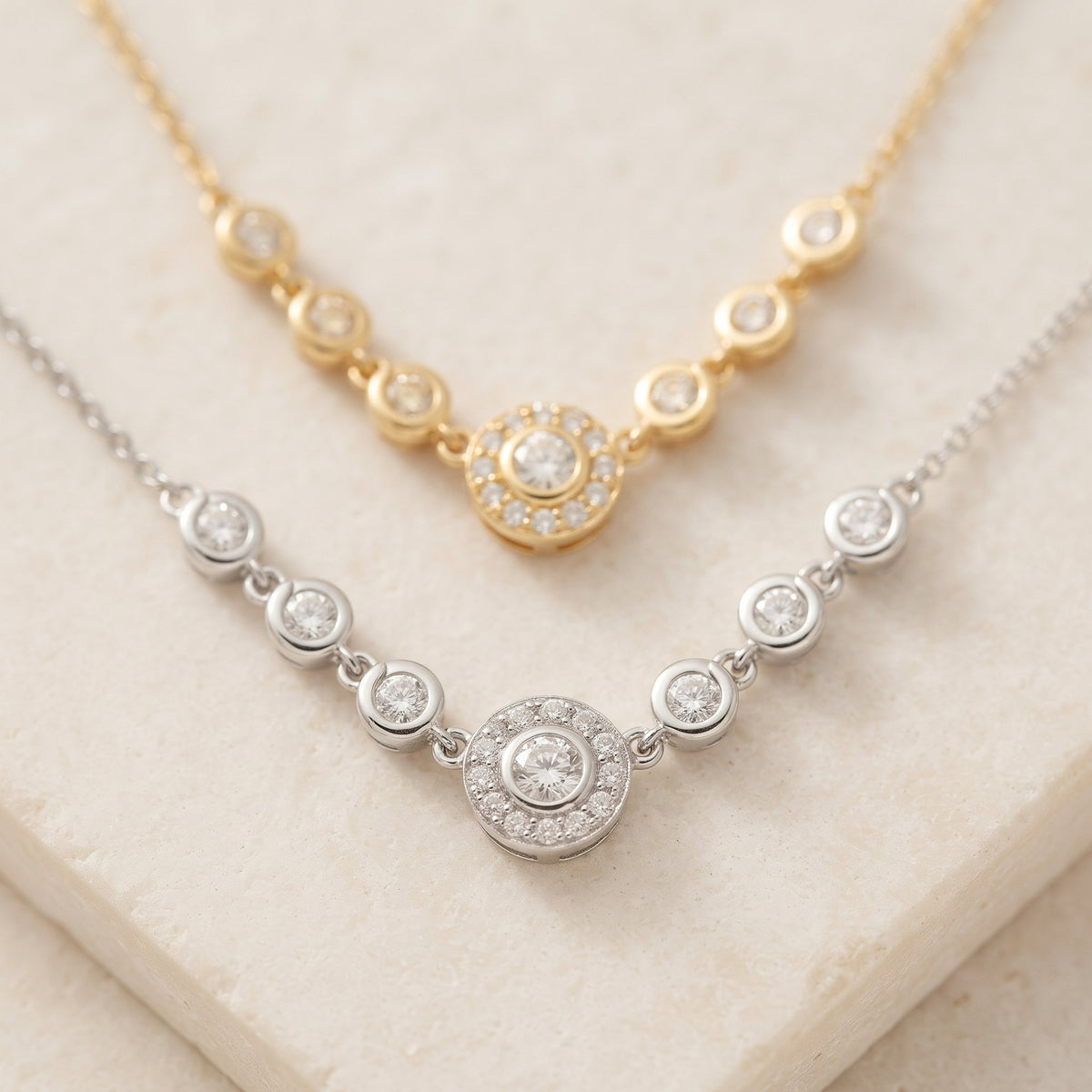 Diamond seven stone halo necklace in 18k white gold and 18k yellow gold