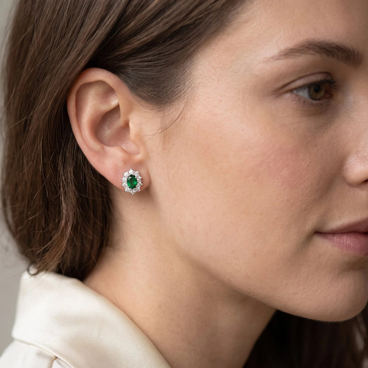 Oval emerald and diamond cluster earrings in 18k white gold and 18k yellow gold