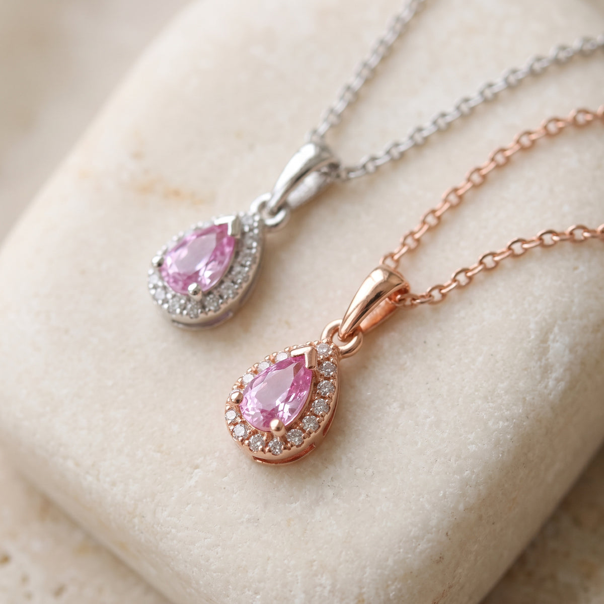 Pear pink sapphire and diamond halo pendants in 18k white and rose gold